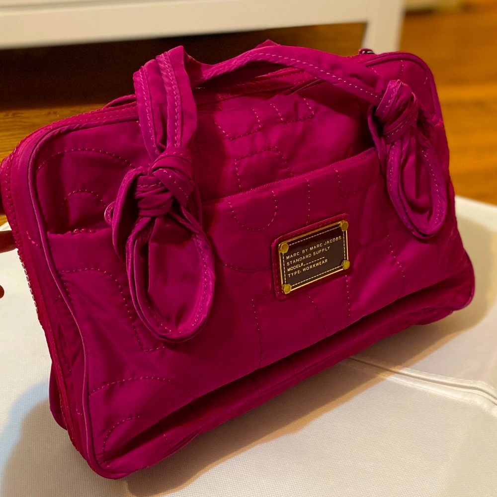 Used Handbag, has a lot of pockets.